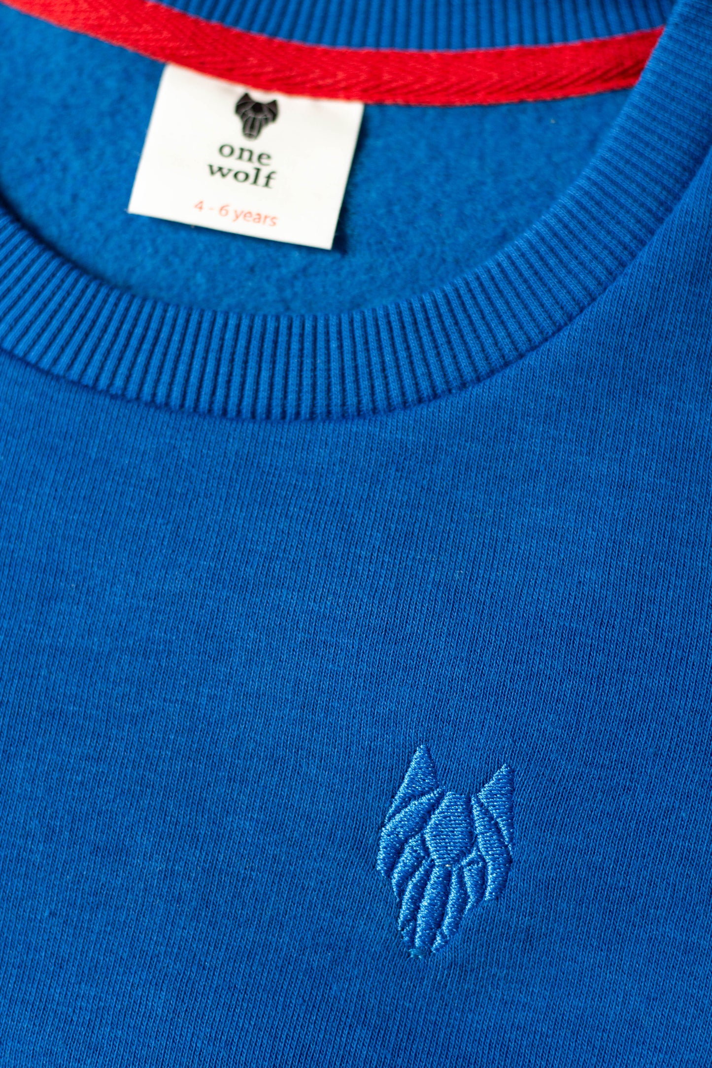 Kid’s One Wolf sweater, blue with blue logo